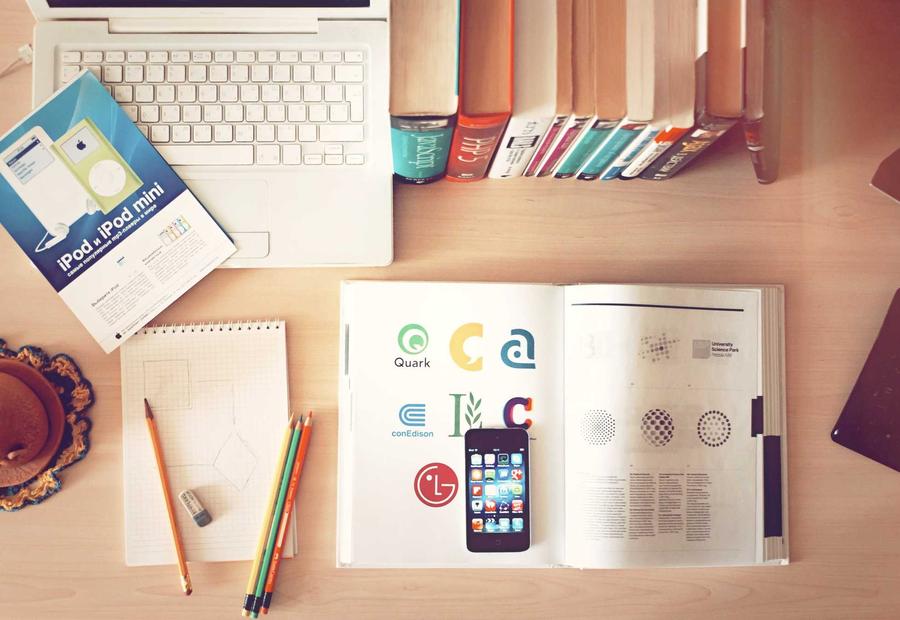 Open logo reference book on a studio desk for Koji Coffee