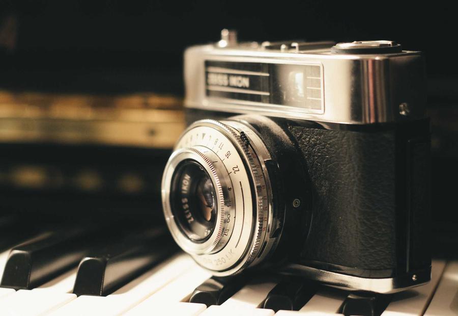 Vintage film camera resting on piano keys for the Pulse rebrand